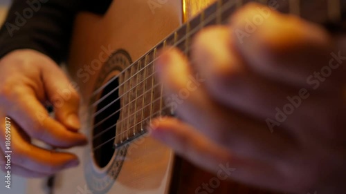 4k Guitarist plays bossa nova music by classic acoustic guitar at the stage during show close-up 