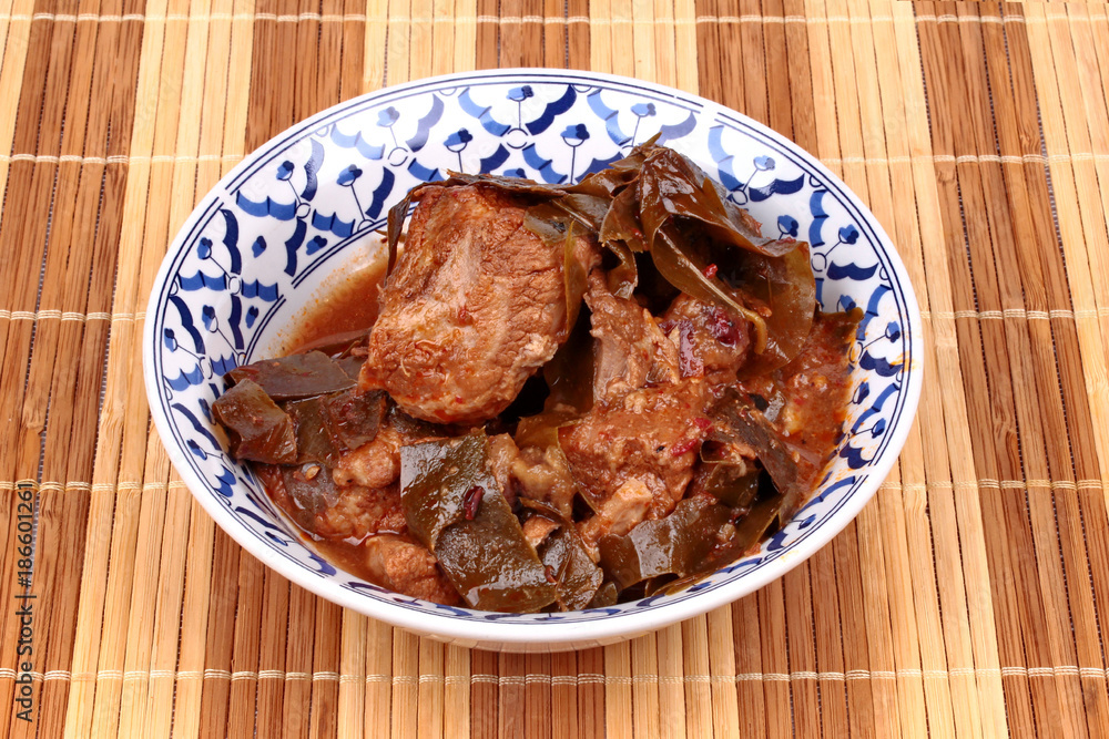 Curry pork with Chamuang (Garcinia cowa) leaves,Local Thai food call as Gang moo cha muang.