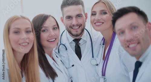 Cheerful team of doctors and interns make selfie