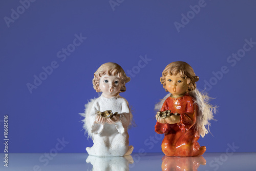 Closeup of two angels made of porcelain