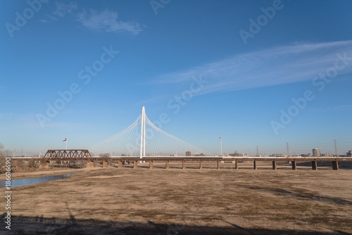 Photography The Margaret Hunt Hill and old railway bridge in Downtown Dallas, Texas, USA spans the Trinity River