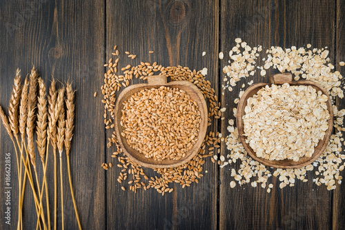 Oat spike herbs or spikelets, oat bunting cereals and oatmeal flakes photo