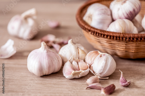 Close up a group of garlic on kitchen wooden table