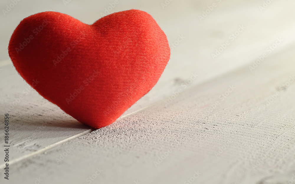 Fototapeta premium Red fabric heart on wooden background ,Valentines day background or Wedding day party
