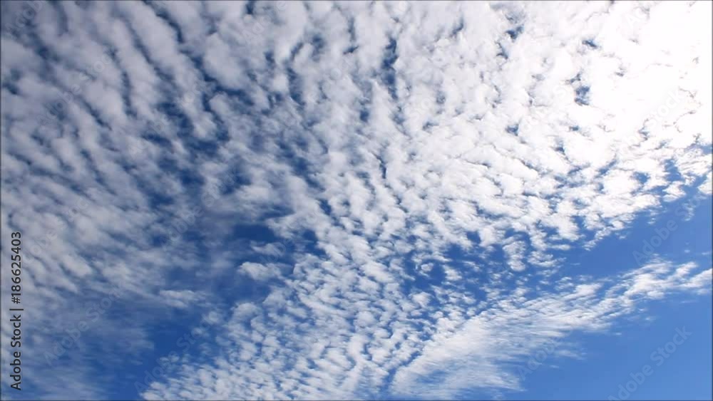 Time-Lapse clip of a azure sky background with bright white racing cumulus clouds Time-Lapse clip of a azure sky background with bright white racing cumulus clouds