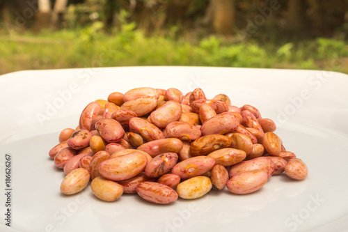 Stack of Cashews on White Plate