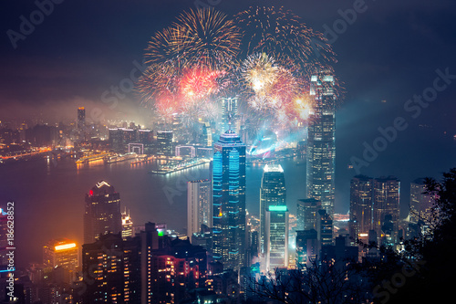 Wall Mural Double exposure of fireworks and Hong Kong city