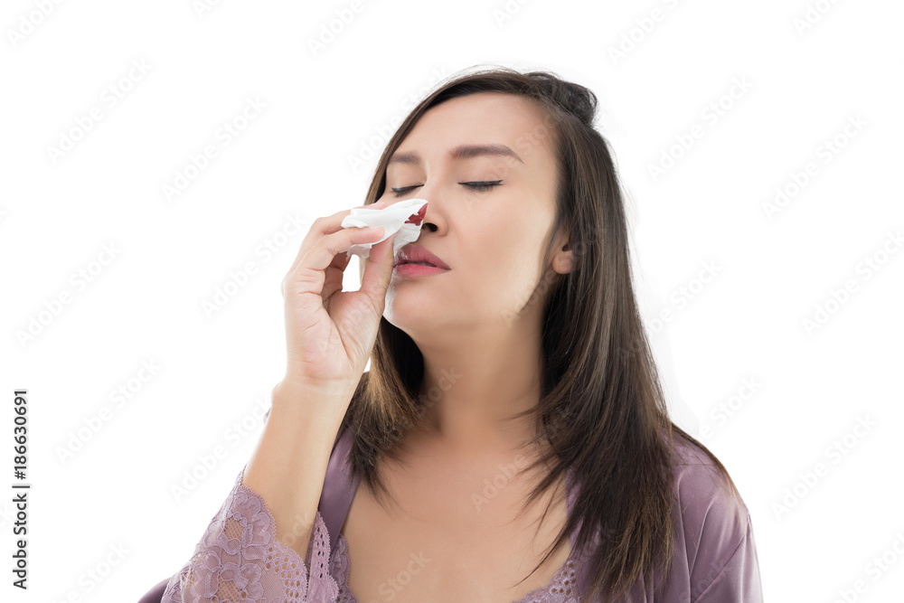 Asian women in satin nightwear with nosebleed isolate on white background, The asian people hurts her nose Asian women in satin nightwear with nosebleed isolate on white background, The asian people hurts her nose