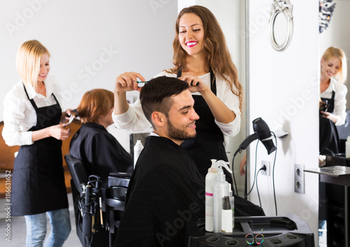 Hairdresser doing hairstyle