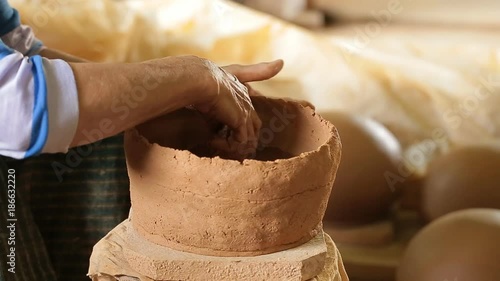 Wallpaper Mural Potter at work. Close-up of woman making ceramic pot on the pottery wheel. Torontodigital.ca