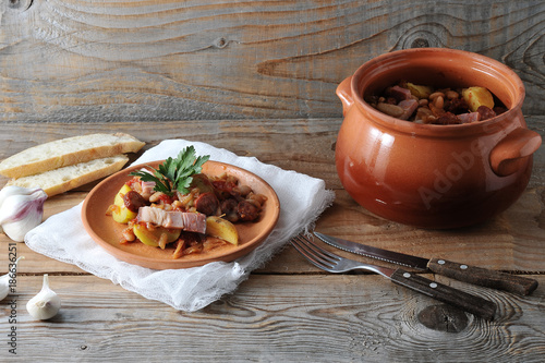 Wallpaper Mural dish cooked in a pot - potatoes, beans, smoked in a clay pot Torontodigital.ca