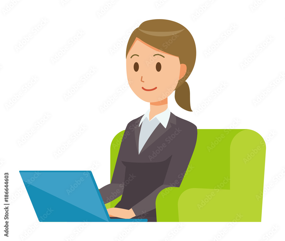 A business woman in a suit sits on a sofa and is operating a laptop computer A business woman in a suit sits on a sofa and is operating a laptop computer