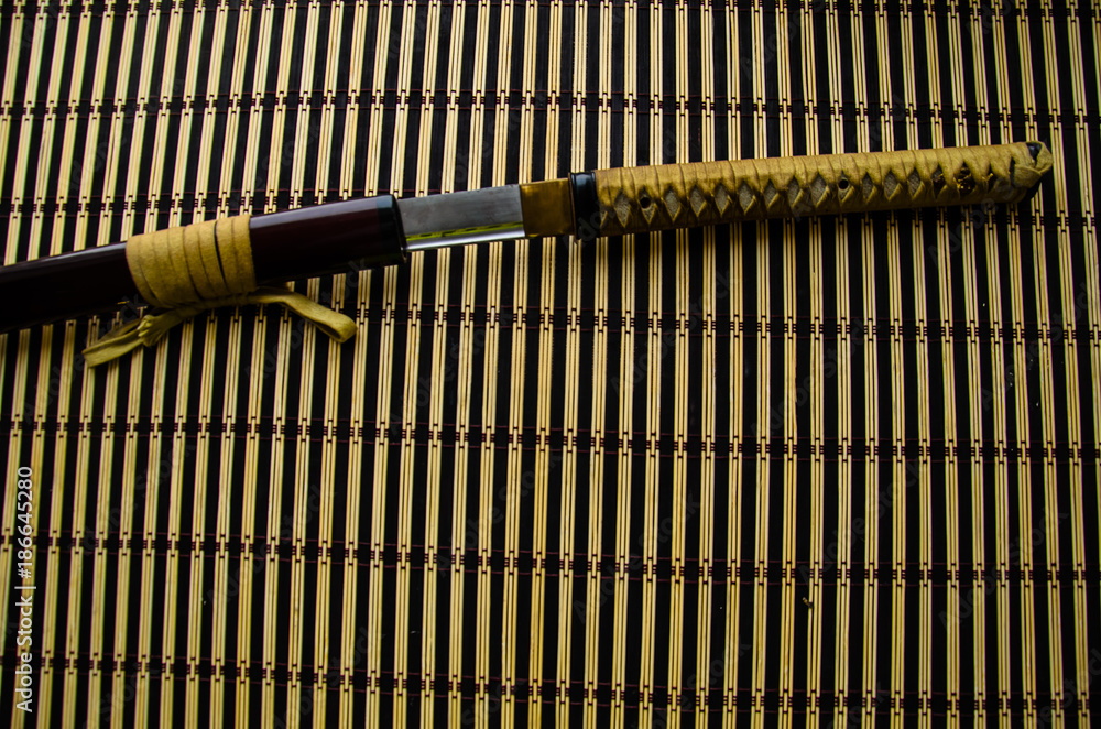 Japanese sword katana on bamboo mat Japanese sword katana on bamboo mat