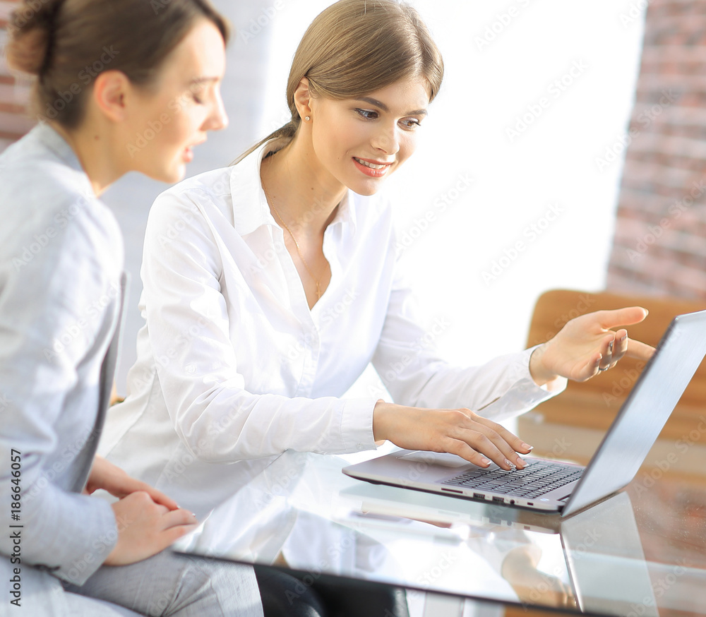 woman Manager shows the client information on the laptop. woman Manager shows the client information on the laptop.
