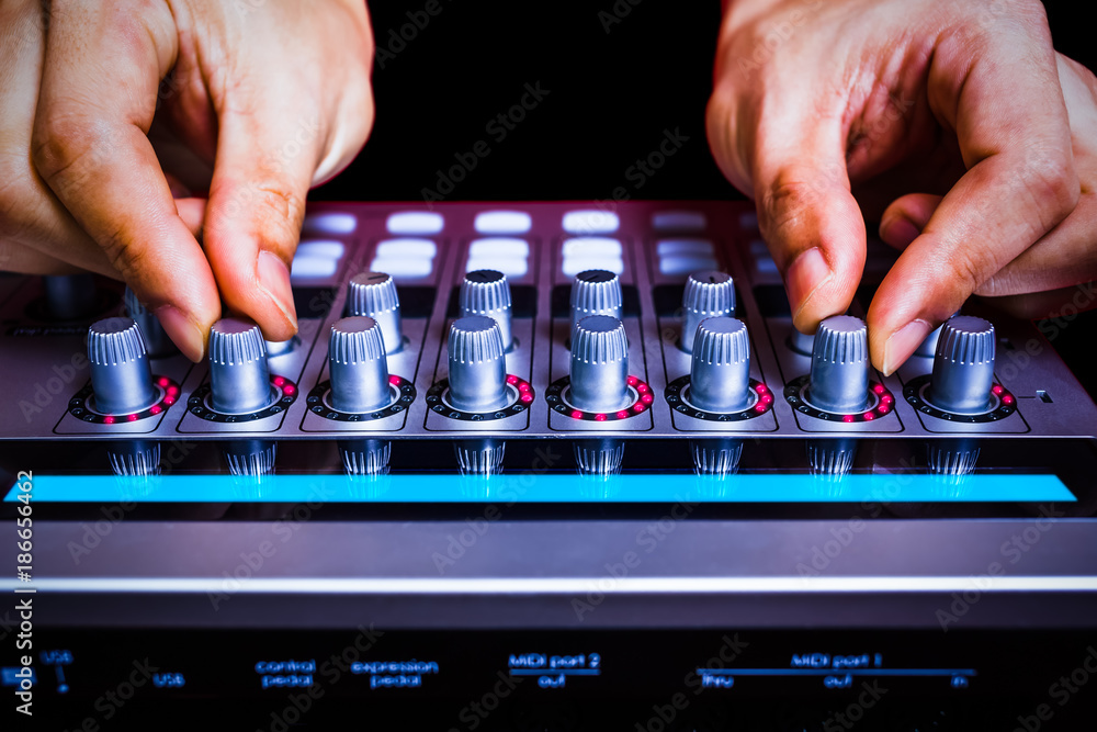 male sound engineer hands tuning knobs of studio gears, digital sound mixer,  pre-amp, audio interface, effect signal processor for TV radio  broadcasting, post production or music background – Stock-Foto | Adobe Stock