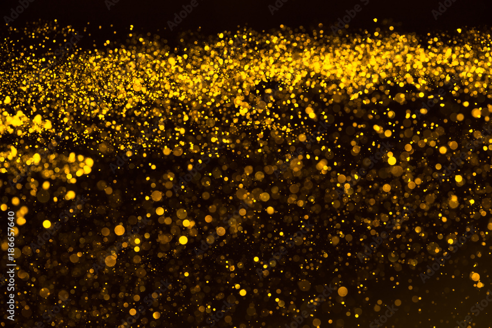 Gold confetti glitter dust rain abstract background