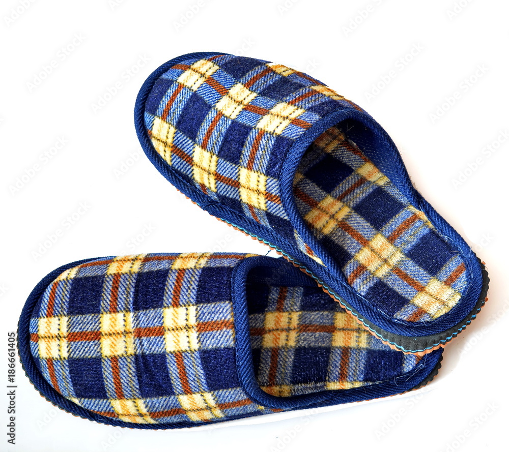 Pair soft comfortable home slippers with Scottish cage for home. Isolated. White background Pair soft comfortable home slippers with Scottish cage for home. Isolated. White background