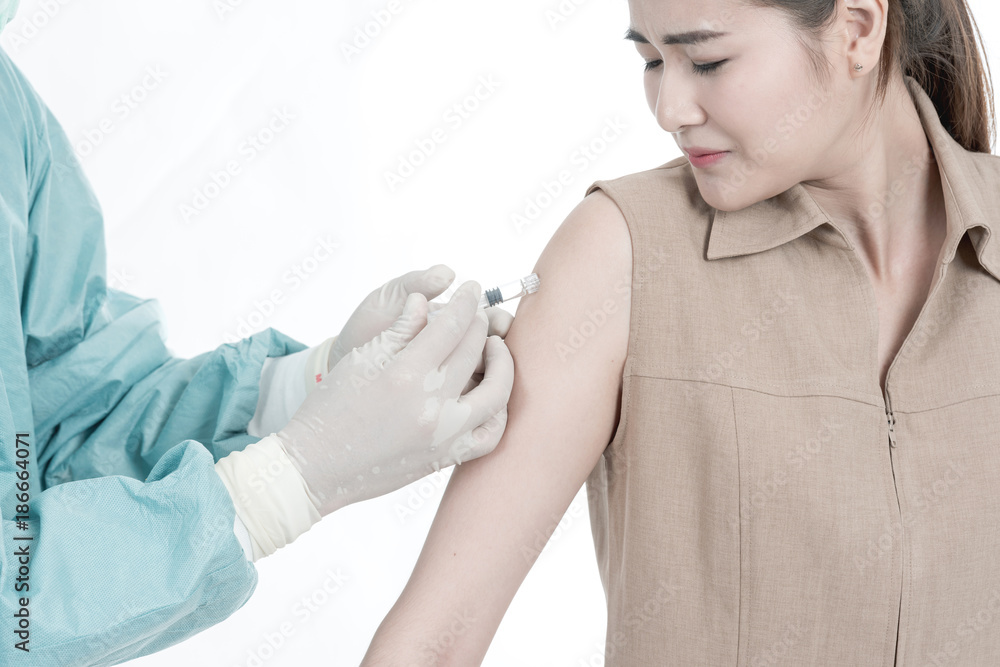 Health care concept. Chinese doctor providing medical injection to his ...