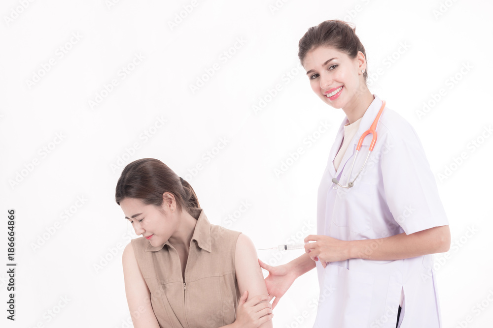 Professional medical career concept. Young female doctor with stethoscope, white cloth isolated in white. Injecting vaccine into her female chinese patient. Professional medical career concept. Young female doctor with stethoscope, white cloth isolated in white. Injecting vaccine into her female chinese patient.