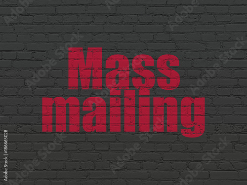 Advertising concept: Painted red text Mass Mailing on Black Brick wall background © Maksim Kabakou
