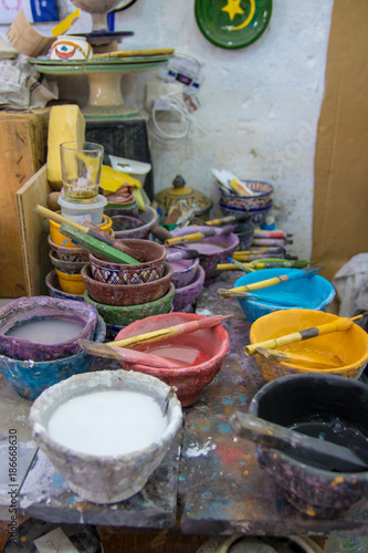 street life morocco marrakech medina making mosaic and painting and making ceramic pots manual labor © henktennapel