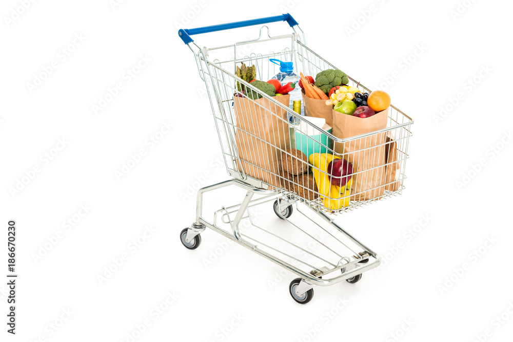 grocery bags in shopping trolley isolated on white grocery bags in shopping trolley isolated on white