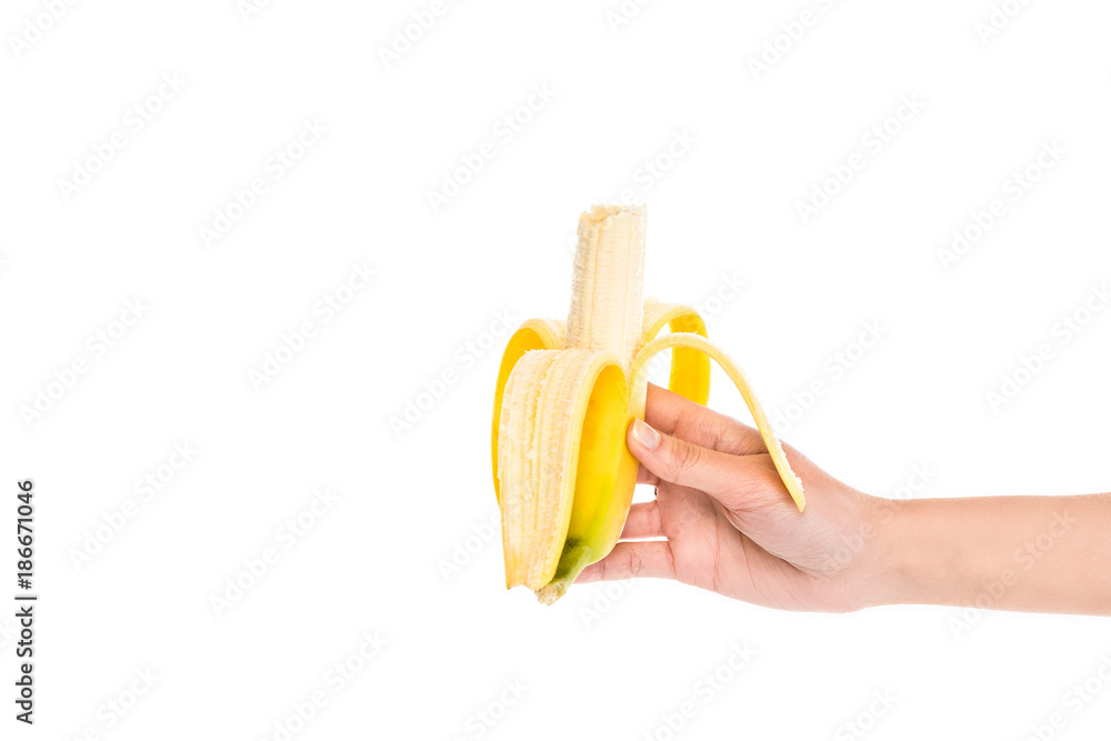 cropped shot of woman holding fresh banana in hand isolated on white cropped shot of woman holding fresh banana in hand isolated on white