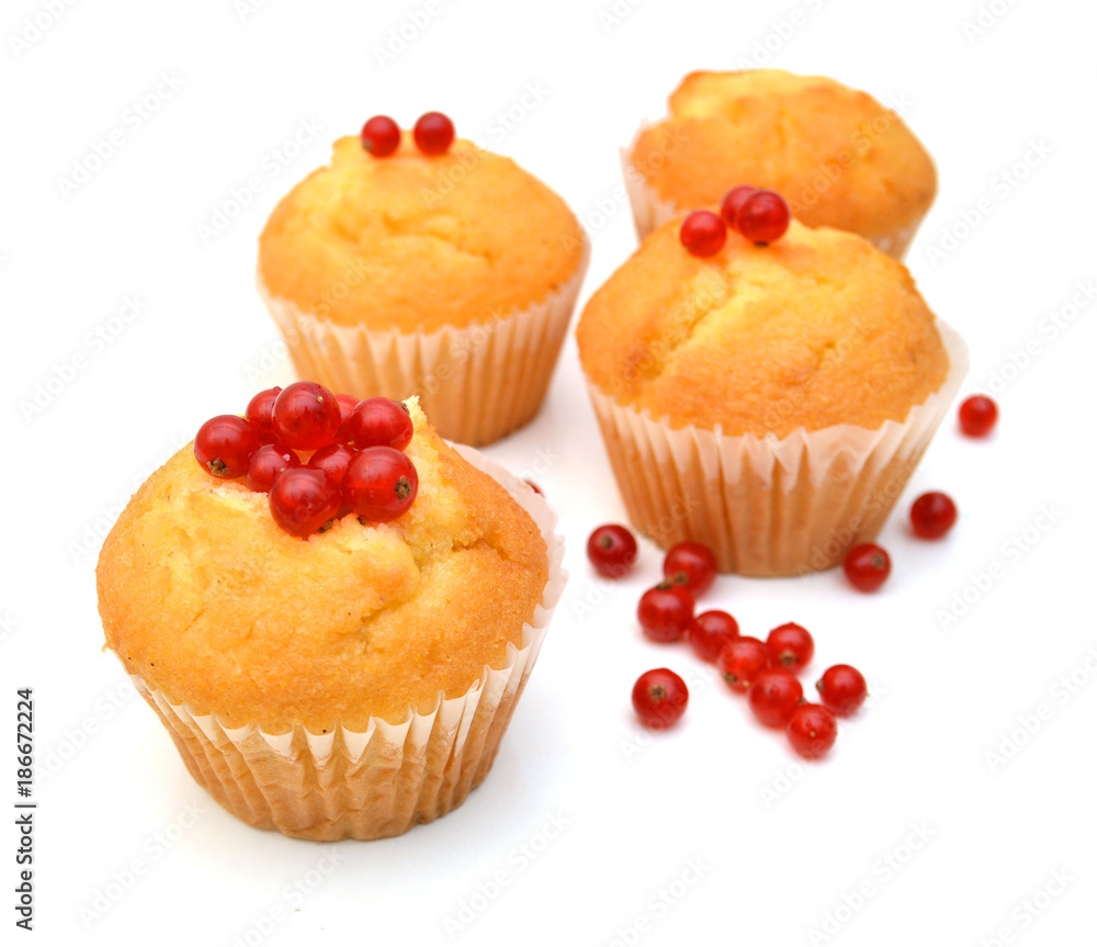 Tasty muffin with red currant berries on white background