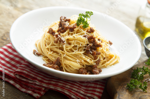 Homemade Bolognese pasta with grated cheese