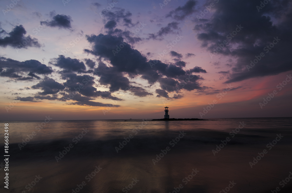 sunset on the beach and light house