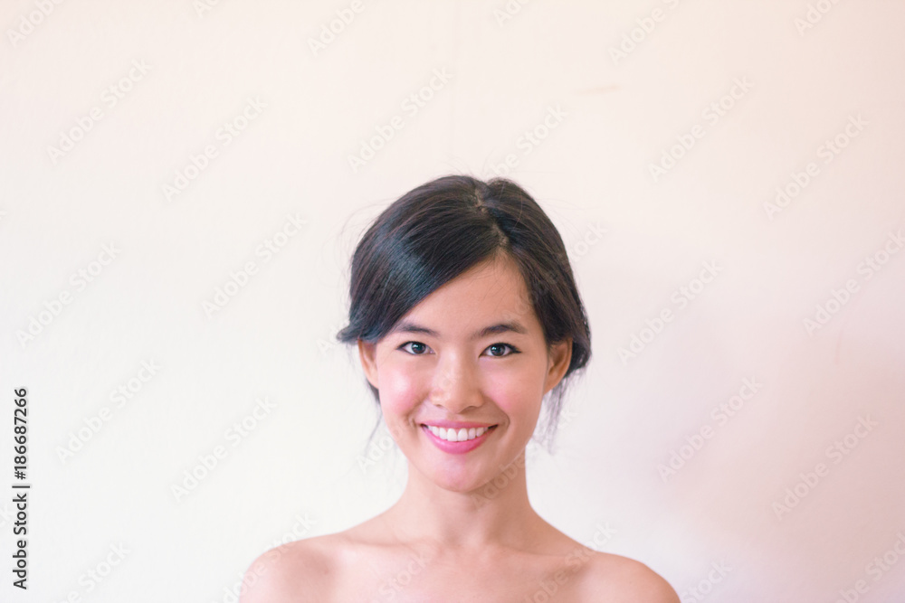 Beauty Skincare concept- Young Asian woman after shower smiling Beauty Skincare concept- Young Asian woman after shower smiling