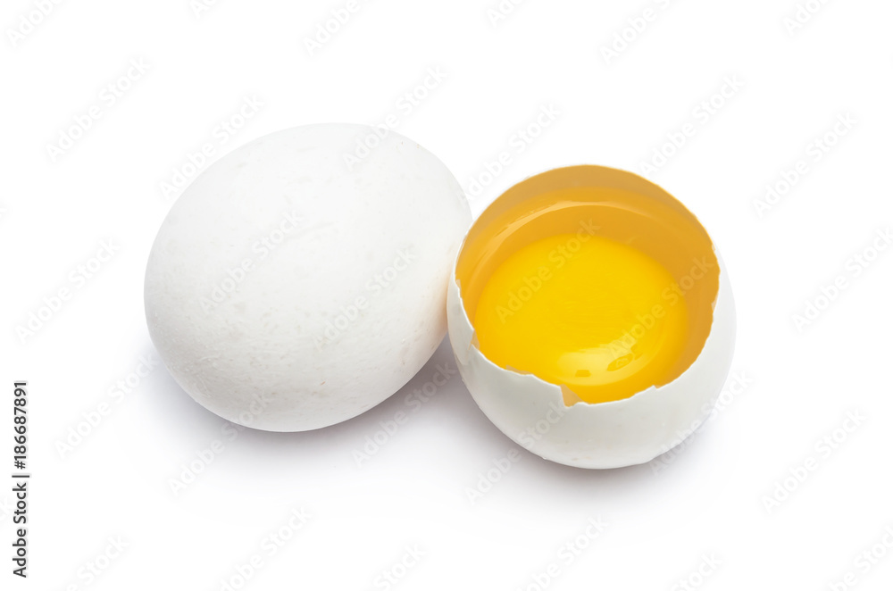 Two chicken eggs one whole, another broken Two chicken eggs one whole, another broken
