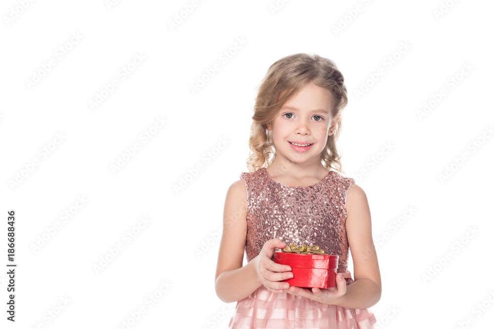 cute kid in pink dress holding heart shaped gift box and smiling at camera isolated on white cute kid in pink dress holding heart shaped gift box and smiling at camera isolated on white