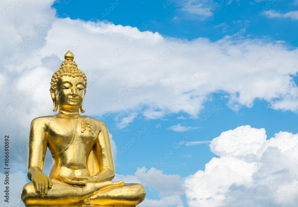 Big buddha at golden triangle on blue sky background, Chiang Rai Province, North of Thailand