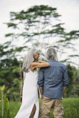 Senior couple looking at tropical landscape