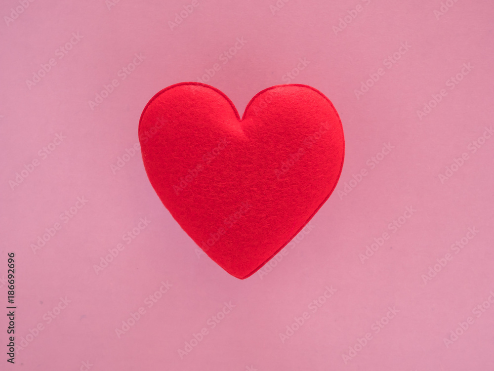 red heart valentine on pink background