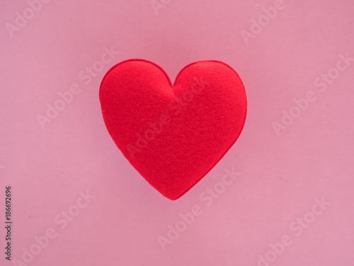 red heart valentine on pink background