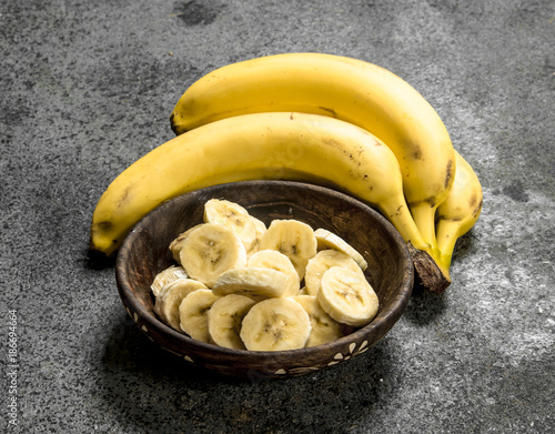 Sliced bananas in a bowl.