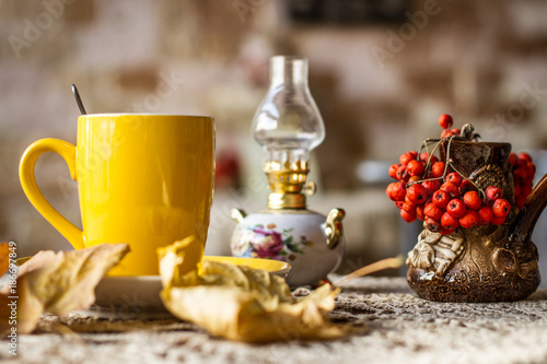 Cup of tea and autumn leaves