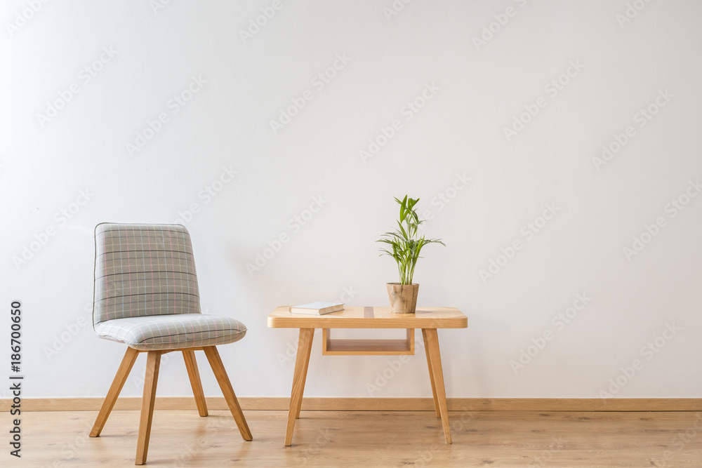 Fototapeta premium Comfy chair next to table
