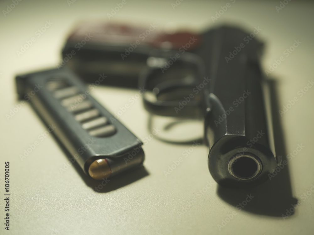 gun and store ammunition on a light table gun and store ammunition on a light table