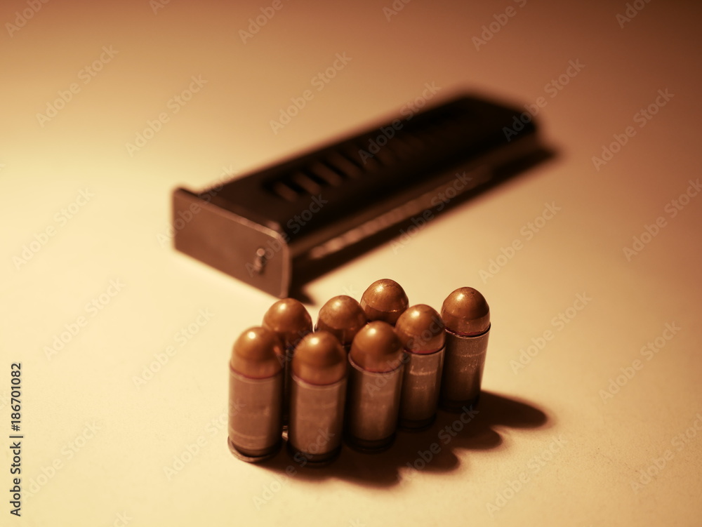9mm pistol bullets on old wooden table. 9mm pistol bullets on old wooden table.