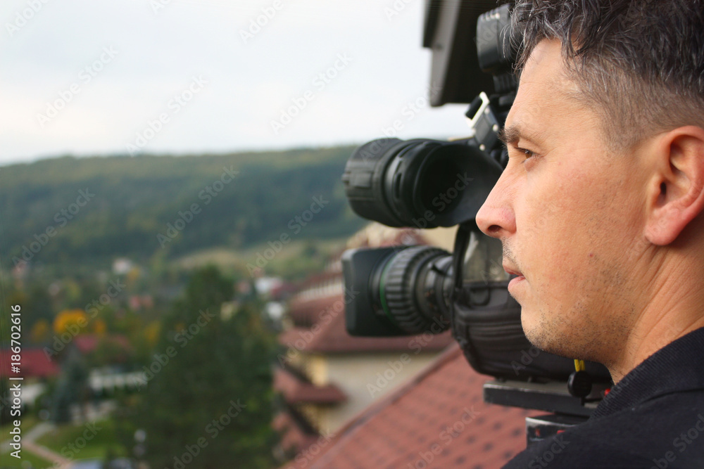 camera operator working with a cinema broadcast TV camera