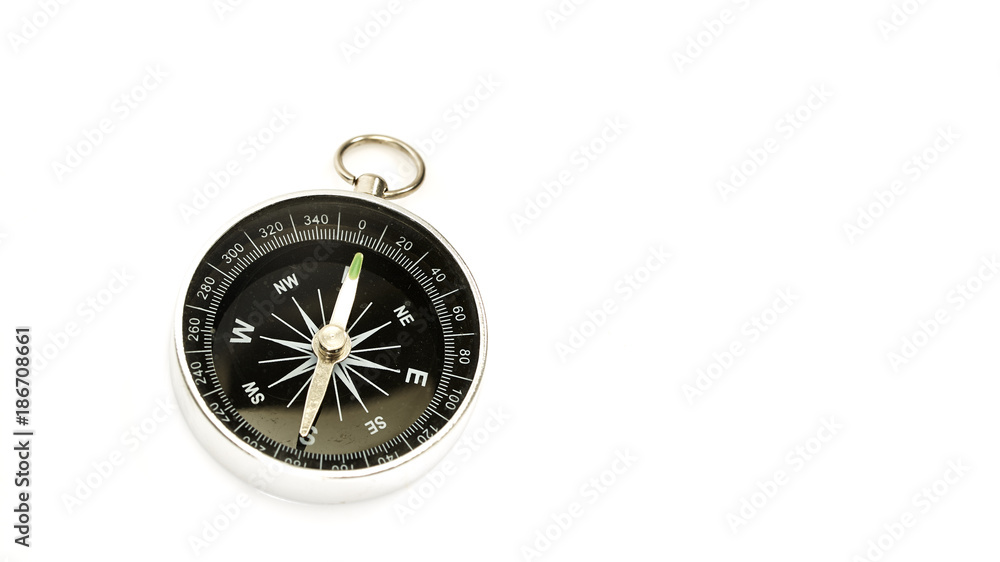 Compass pointing north on white
