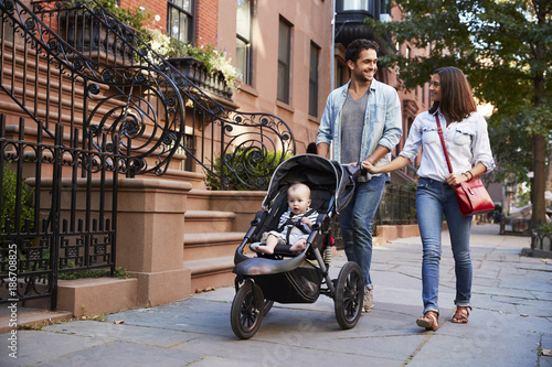 Family taking a walk down the street, close up