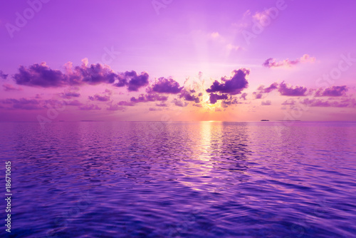 Fantastic sunset. A violet sunset over the ocean. photo