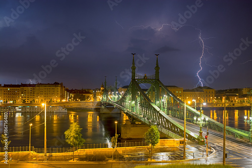 Night lighting hit over Liberty bridge in Budapest