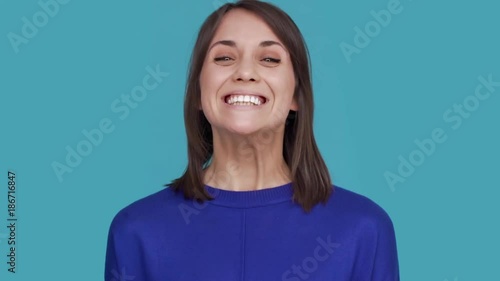 Portrait of different facial expressions of female showing mood swings jumping from happiness to sadness or disappointment over white background. Concept of emotions photo