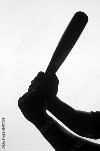 Silhouette of baseball bat in hands