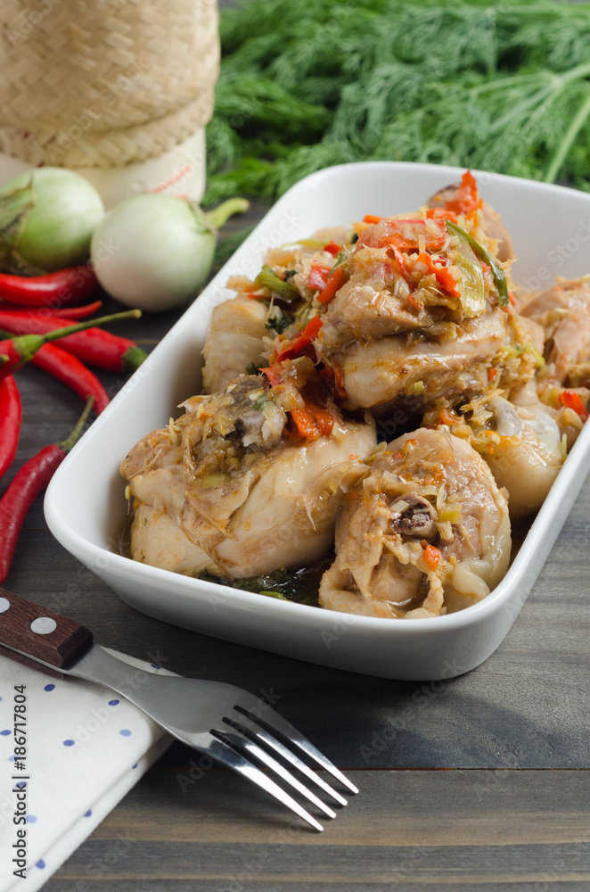 Spicy steamed chicken with herbs. Thai food concept. Spicy steamed chicken with herbs. Thai food concept.